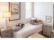 Inviting bedroom with classic coastal decor and two side tables with lamps at 126-C Jungle Rd, Edisto Beach, SC 29438