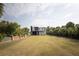 Landscaped lot with home featuring fenced backyard and private lot at 126-C Jungle Rd, Edisto Beach, SC 29438