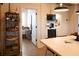 Bright kitchen view with white countertops, white cabinets, and an open doorway to the bedroom at 126-C Jungle Rd, Edisto Beach, SC 29438