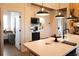 Eat in kitchen with white countertops, black appliances, and modern pendant lighting at 126-C Jungle Rd, Edisto Beach, SC 29438