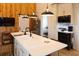 Bright kitchen view with white countertops, stainless appliances, and a view to the bedroom at 126-C Jungle Rd, Edisto Beach, SC 29438