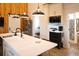 Bright kitchen view with white countertops, stainless appliances, and a view to the bathroom at 126-C Jungle Rd, Edisto Beach, SC 29438