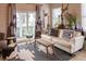 Inviting living room with a white sofa, rug, and bright windows at 126-C Jungle Rd, Edisto Beach, SC 29438