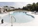 Inviting outdoor pool with lounge chairs and clear blue water in a fenced in area at 126-C Jungle Rd, Edisto Beach, SC 29438