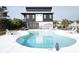 Exterior of home features a beautiful private pool with deck chairs for ultimate relaxation at 126-C Jungle Rd, Edisto Beach, SC 29438