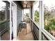Charming screened porch with comfortable seating, perfect for enjoying the outdoors in any weather at 126-C Jungle Rd, Edisto Beach, SC 29438