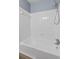 Bright white bathroom with tub and shower combo and gray accent paint at 1383 W Lenevar Dr, Charleston, SC 29407