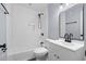 Modern bathroom featuring subway tile shower, black fixtures, and a white vanity at 1383 W Lenevar Dr, Charleston, SC 29407