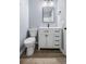 Bathroom with white vanity, black hardware, modern lighting, and light paint at 1383 W Lenevar Dr, Charleston, SC 29407