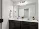 Elegant bathroom featuring a double vanity with white countertop and modern fixtures at 1441 Arabella St, Charleston, SC 29414