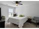 Bright bedroom featuring a ceiling fan, a comfortable queen-size bed, and natural light from the window at 1441 Arabella St, Charleston, SC 29414