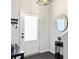 Welcoming foyer with front door, decorative mirror, and table, creating an inviting entrance at 1441 Arabella St, Charleston, SC 29414