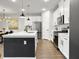 Open-concept kitchen featuring stainless steel appliances, a large island, and plenty of cabinet space at 1441 Arabella St, Charleston, SC 29414