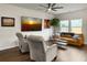 Comfortable living room featuring hardwood floors, ceiling fan, cozy seating, and natural light at 1441 Arabella St, Charleston, SC 29414
