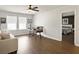 Inviting living room with hardwood floors, a comfortable sofa, and a view of the connected bedroom at 1441 Arabella St, Charleston, SC 29414