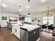 Spacious living area featuring an open layout, a kitchen island, a dining area, and modern furnishings at 1441 Arabella St, Charleston, SC 29414
