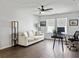 Bright and airy home office with a comfortable couch, desk, ceiling fan, and natural light at 1441 Arabella St, Charleston, SC 29414