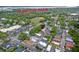 Aerial view of a neighborhood near Hampton Park, featuring many houses and a commercial building with a parking lot at 15 Dewey St, Charleston, SC 29403