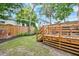 Multi-level back yard featuring a wooden fence, stairs and garden at 15 Dewey St, Charleston, SC 29403