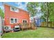 Backyard with wooden deck, green lawn, golf cart, and privacy fence at 15 Dewey St, Charleston, SC 29403