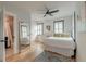 Spacious bedroom with hardwood floors, two windows with shutters, and adjacent bathroom access at 15 Dewey St, Charleston, SC 29403