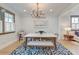 Elegant dining area with modern lighting and a cozy seating arrangement at 15 Dewey St, Charleston, SC 29403