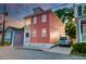 Exterior angle view of a two-story house with a car parked on the concrete driveway at 15 Dewey St, Charleston, SC 29403