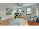 Bright home office with multiple windows, modern desk, and comfortable seating at 15 Dewey St, Charleston, SC 29403