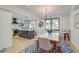 Open kitchen and dining area with island seating and modern appliances at 15 Dewey St, Charleston, SC 29403