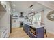 Modern kitchen with a blue island, marble countertops, and updated appliances at 15 Dewey St, Charleston, SC 29403