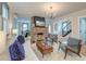 Bright living room with a brick fireplace and modern decor at 15 Dewey St, Charleston, SC 29403