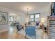 Comfortable living room leading to a dining area with ample natural light at 15 Dewey St, Charleston, SC 29403