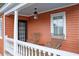 Charming porch with wicker chairs, lantern lighting, and a cozy atmosphere at 15 Dewey St, Charleston, SC 29403