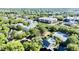 Expansive aerial view showcasing the community's layout, including condos, tennis courts, and waterfront access at 1551 Ben Sawyer Blvd # 23, Mount Pleasant, SC 29464