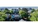Blue waterfront home featuring a porch, balcony, and garage, surrounded by lush trees and beautiful water views at 1551 Ben Sawyer Blvd # 23, Mount Pleasant, SC 29464