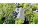 Aerial view of a well maintained home with a gray roof and surrounded by mature landscaping at 1551 Ben Sawyer Blvd # 23, Mount Pleasant, SC 29464