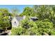 An aerial view of a tan home surrounded by mature trees at 1551 Ben Sawyer Blvd # 23, Mount Pleasant, SC 29464