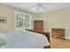 Bright bedroom with hardwood floors, large windows and comfortable bed and antique furniture at 1551 Ben Sawyer Blvd # 23, Mount Pleasant, SC 29464