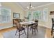 Dining room features a chandelier and large windows with plantation shutters at 1551 Ben Sawyer Blvd # 23, Mount Pleasant, SC 29464