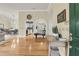 Entryway featuring hardwood floors, an arched doorway, and views of the dining room and kitchen at 1551 Ben Sawyer Blvd # 23, Mount Pleasant, SC 29464
