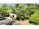 View of a well-maintained home on a tree-lined street with a two-car garage at 1551 Ben Sawyer Blvd # 23, Mount Pleasant, SC 29464
