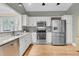 Bright kitchen with stainless steel appliances and hardwood floors at 1551 Ben Sawyer Blvd # 23, Mount Pleasant, SC 29464