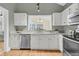 Bright, updated kitchen with white cabinets and granite countertops at 1551 Ben Sawyer Blvd # 23, Mount Pleasant, SC 29464