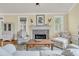 Living room showcasing fireplace, hardwood floors and comfortable seating at 1551 Ben Sawyer Blvd # 23, Mount Pleasant, SC 29464