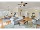 Open-concept living room with hardwood floors and views into the kitchen and dining area at 1551 Ben Sawyer Blvd # 23, Mount Pleasant, SC 29464