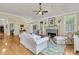 Bright living room with fireplace, hardwood floors, and comfortable seating at 1551 Ben Sawyer Blvd # 23, Mount Pleasant, SC 29464