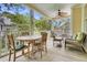 Inviting screened porch featuring a dining table and comfortable seating, perfect for outdoor relaxation at 1551 Ben Sawyer Blvd # 23, Mount Pleasant, SC 29464