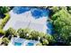 Overhead shot of well-maintained tennis courts in a lush community setting, surrounded by manicured greenery at 1551 Ben Sawyer Blvd # 23, Mount Pleasant, SC 29464