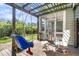 Inviting covered back deck with a swing, screened-in porch, and space for relaxing and enjoying the outdoors at 1572 Pixley St, Charleston, SC 29414