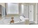 Clean bathroom featuring a shower, bathtub, and frosted window at 1572 Pixley St, Charleston, SC 29414
